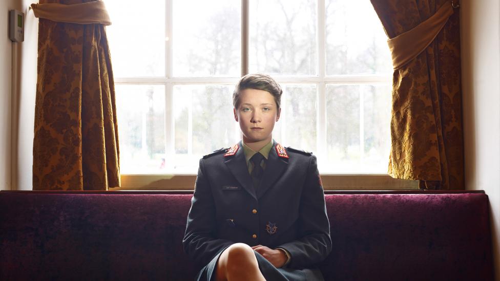 Photo of a cadet sitting in a room